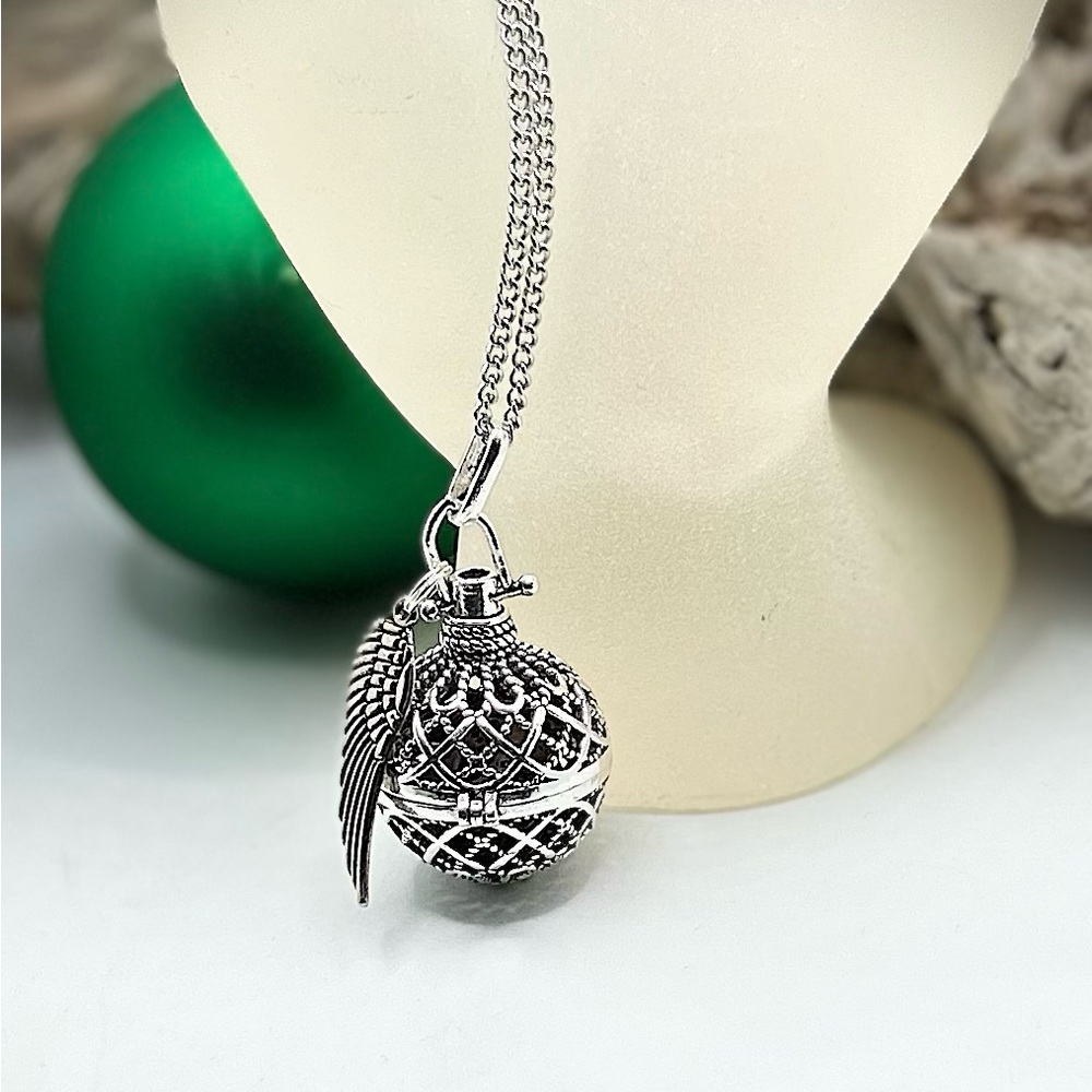 Elegant Silver Tone Lava Pendant Cage Necklace with Wing Charm